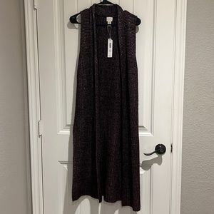 NWT long sweater vest, sleeveless.  Looks great with jeans and cowboy boots